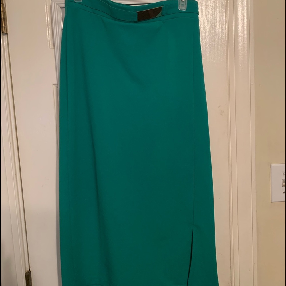 Green pencil skirt with silver belt attached
